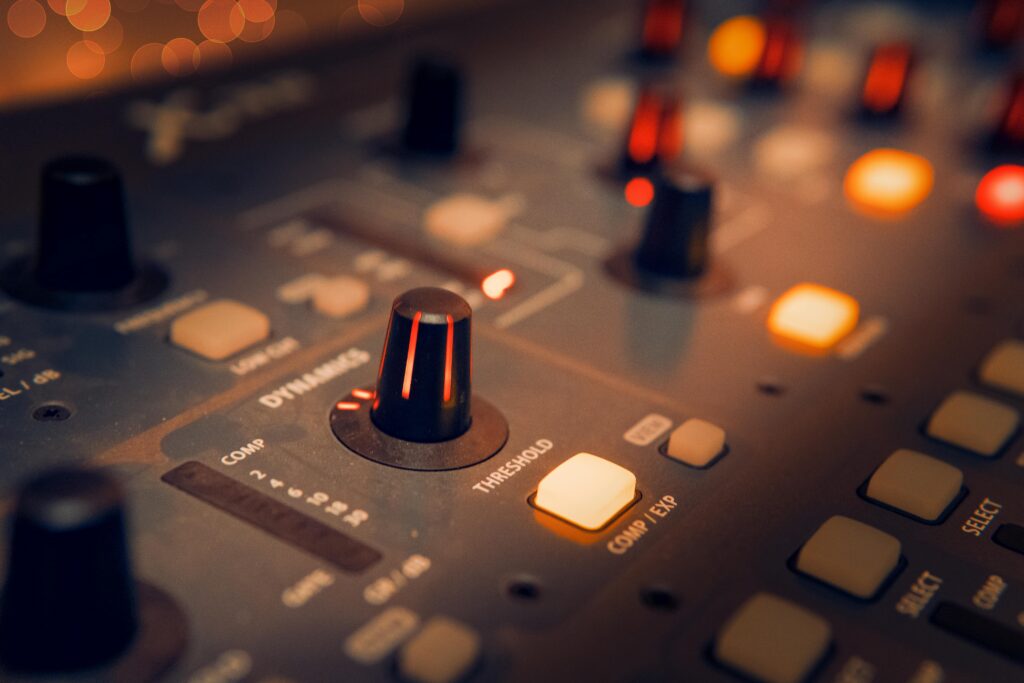 pexels-photo-3784221-3784221 A detailed view of an audio mixer with glowing knobs, perfect for music production themes.